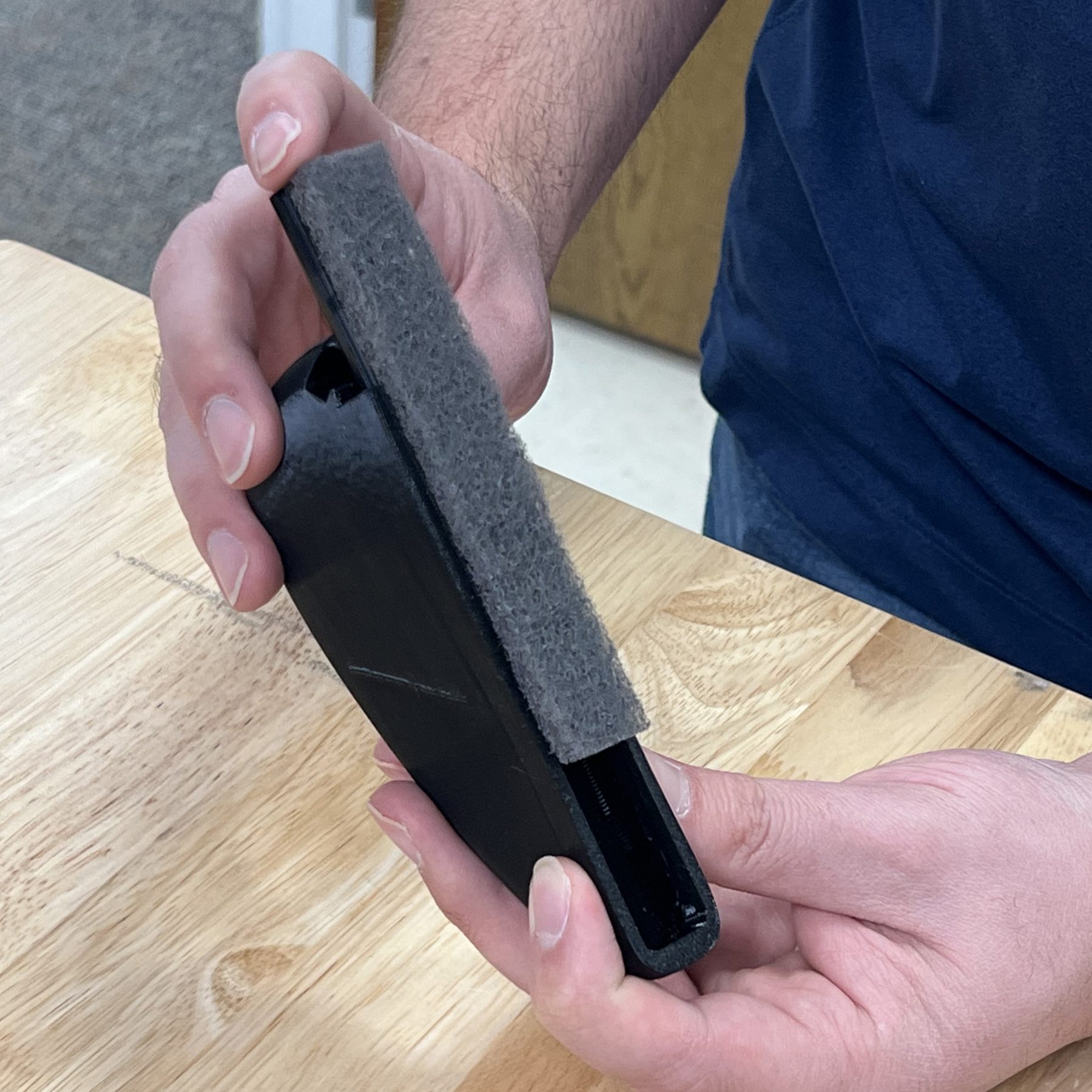 Fresh scouring pad being fed back into the channel