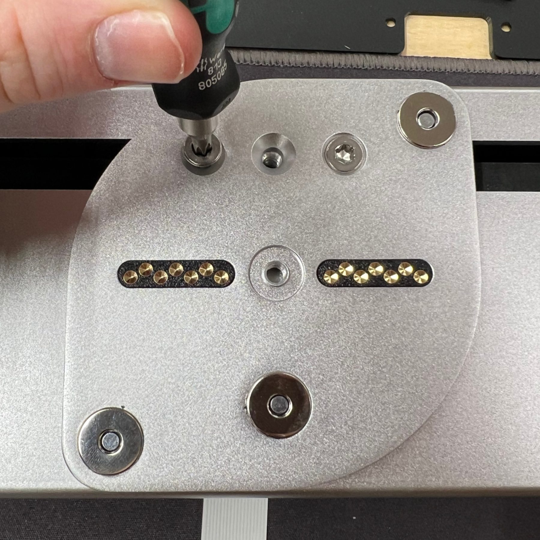 Installing the hinge plate that lets the upper body pivot.