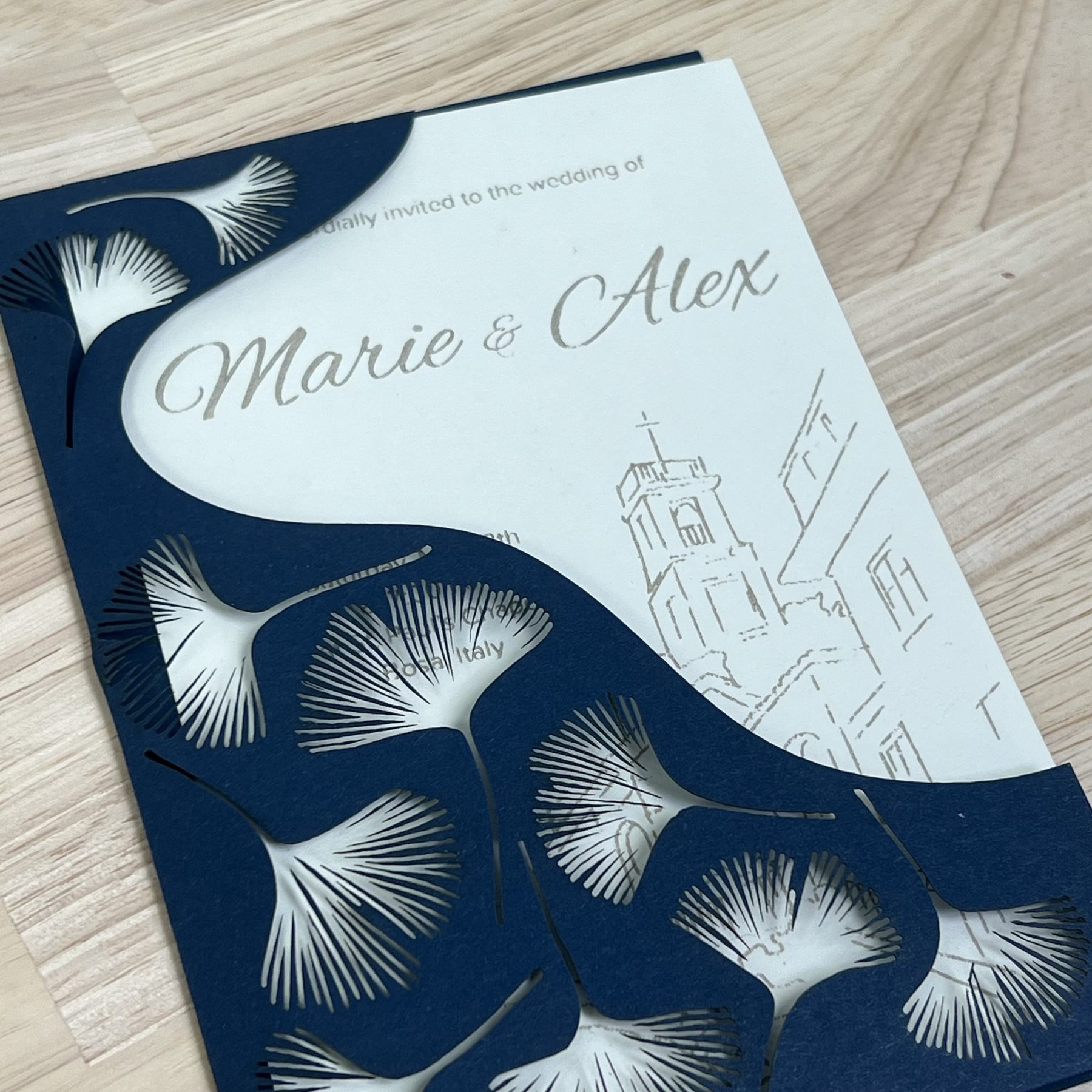 Laser-cut wedding invitation with ginkgo leaf pattern