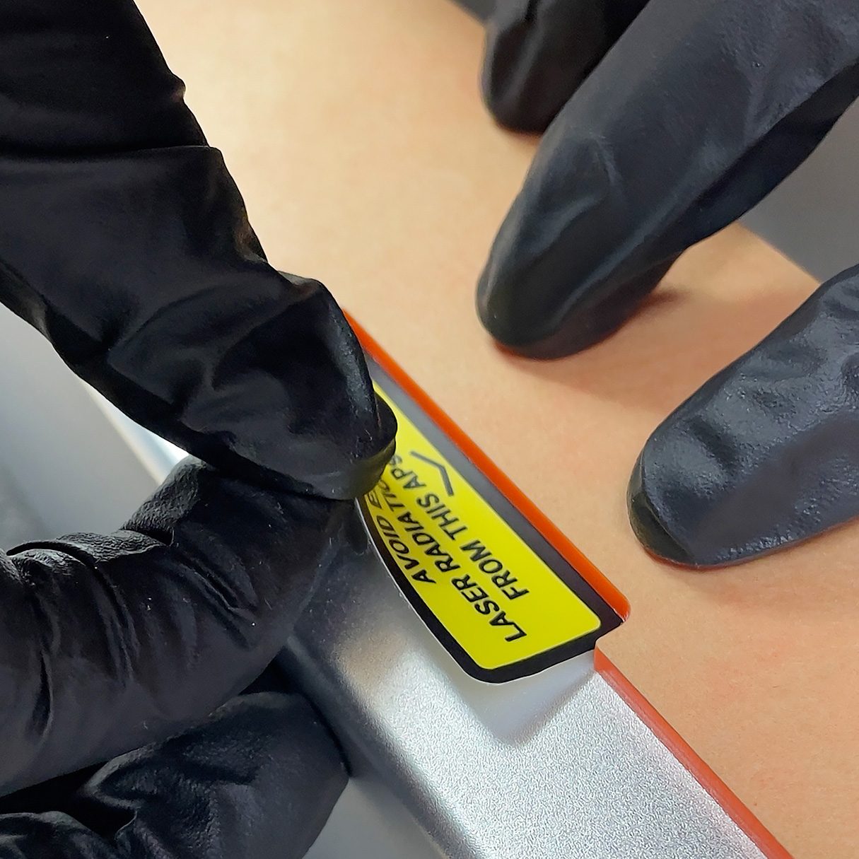 Adding laser aperture warning sticker.